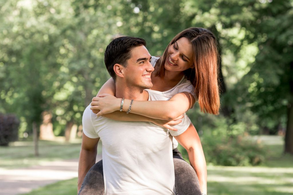 Couple enjoying a day in the park, symbolizing successful spousal sponsorship in Canada.