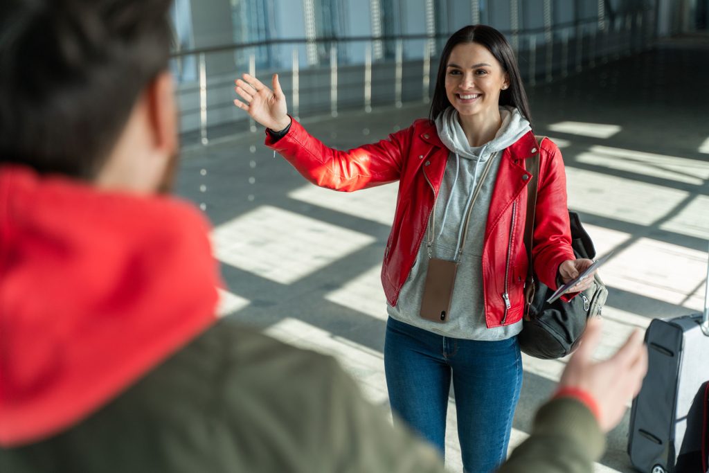Reunion of a couple at the airport, symbolizing common-law partner sponsorship in Canada