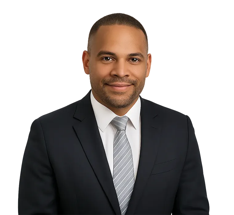 Edgar Cruz – Restoration of Status Success Story-IP Portrait of Edgar Cruz, a satisfied client wearing a navy suit and light striped tie, smiling confidently after restoring his status in Canada with Immigration Pros.