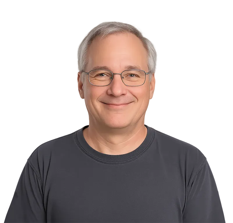 Happy Federal Skilled Worker Client Sharing His Experience-IP A middle-aged Caucasian man with glasses and a friendly smile, wearing a dark t-shirt, representing a satisfied client who successfully immigrated to Canada through the Federal Skilled Worker Program.