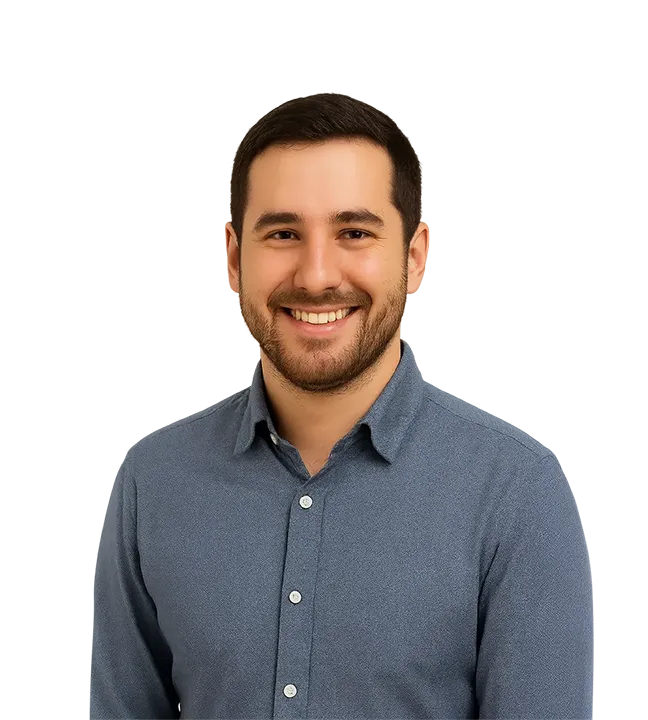 Portrait of Martin Azcarraga, a smiling client in a blue patterned shirt, who successfully obtained a Temporary Resident Visa with the support of Immigration Pros’ professional team.